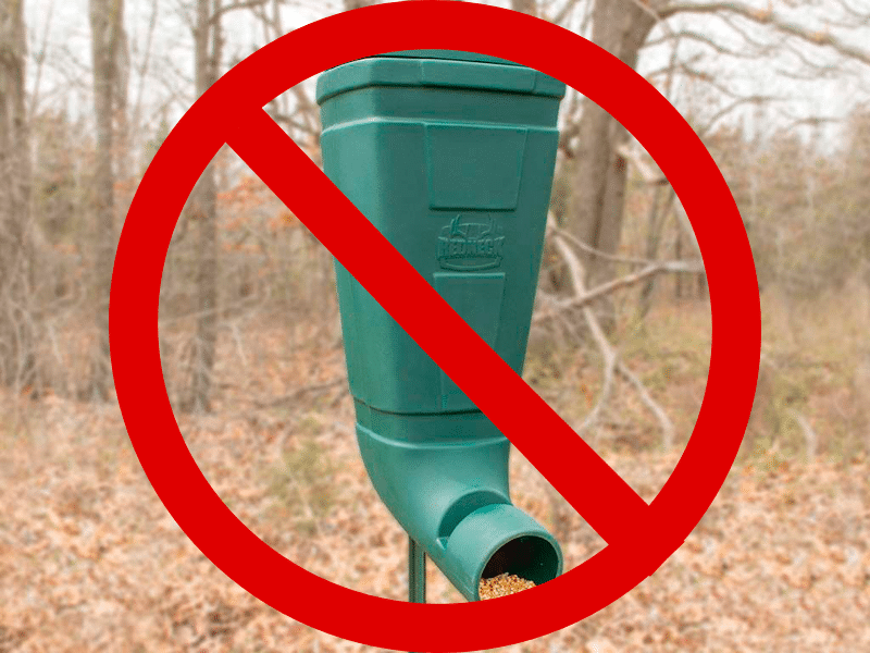 redneck t post feeder with not allowed sign on it