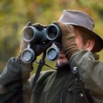 Hunter using binoculars