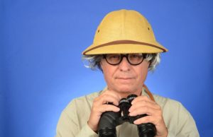 man with glasses and binoculars