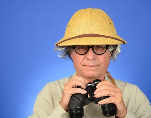 man with glasses and binoculars