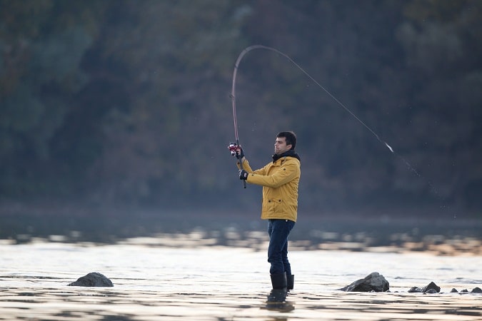 Man fishing on river