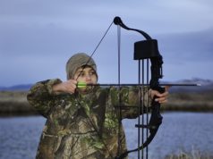 kid with youth compound bow