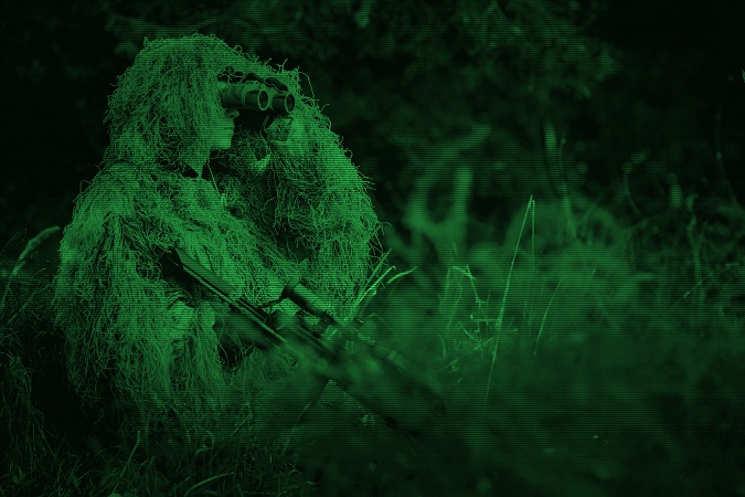 Hunter with night vision binocular