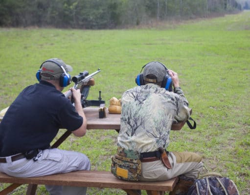 spotter checking the distance to target with long-range rangefinder