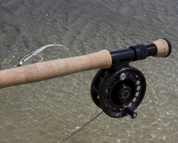 Photo of rod, reel, and fly of salt water setup.
