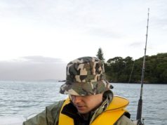 angler holding saltwater rod and reel