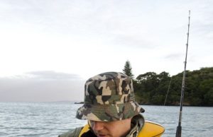 angler holding saltwater rod and reel