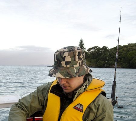 angler holding saltwater rod and reel