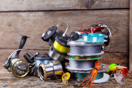 fishing tackles, baits, reels, spool with line