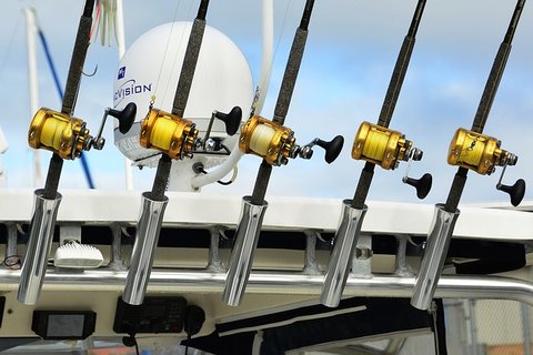 5 saltwater reels on a boat