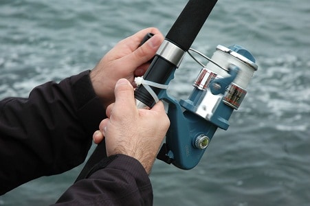 fisher with saltwater reel
