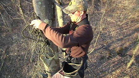 hunter setting up treestand