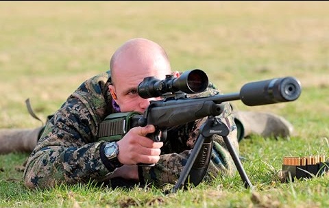 Man shooting rifle on bipod