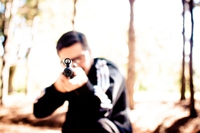 man targeting a rifle