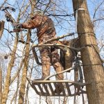 Hunter on tree stand