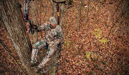 Hunter sitting on tree stand