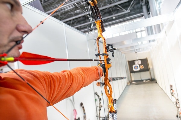 archer shooting a compound bow