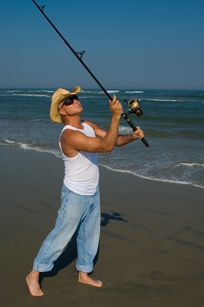 man fishing on shore
