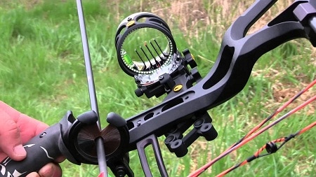 pin sight and arrow in rest