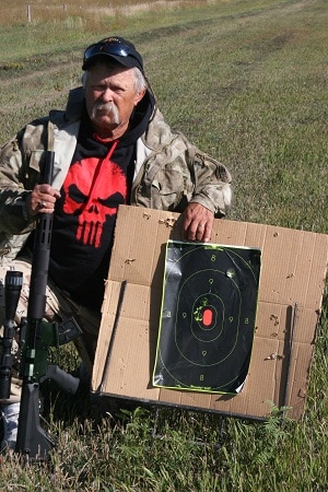 Author with fresh target shot at 150 yards via the alexander arms 17.