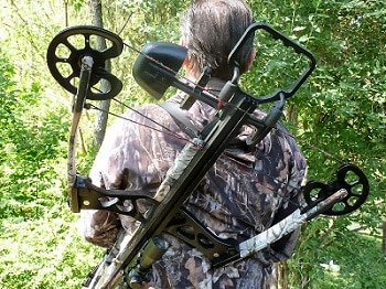 crossbow slinged at the back