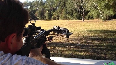 hunter aiming a crossbow