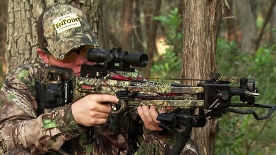 hunter aiming crossbow
