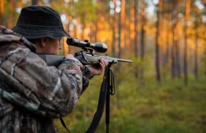 hunter aiming with rifle