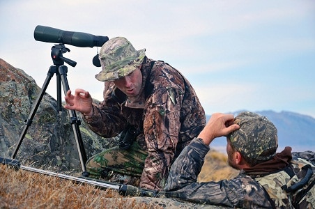 hunters with spotting scope