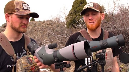 men with spotting scopes and binocs