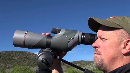 shooter looking through spotting scope