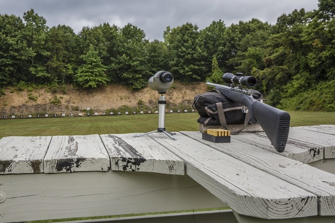 spotting scope and rifle