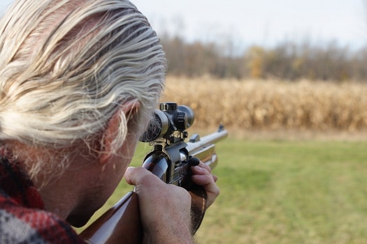Hunter aiming a shotgun