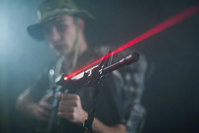 soldier-holding-M16-with-laser-sight-1.jpeg