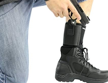 man with ankle holster holding gun