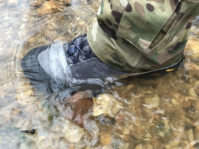 tactical boot submerged in water