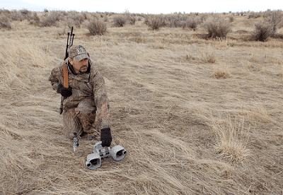 A hunter placing predator call