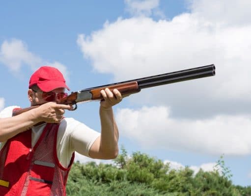 Man shooting skeet with a shotgun