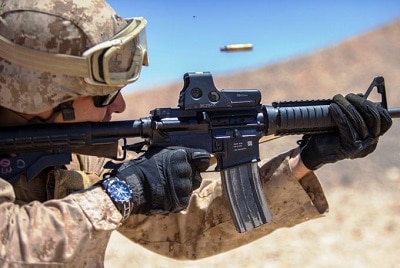 A soldier using red dot sight
