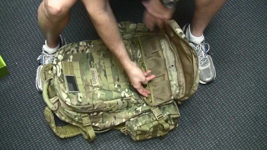 tactical backpack on floor