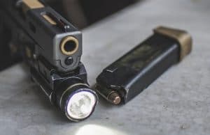 unloaded pistol with light attached
