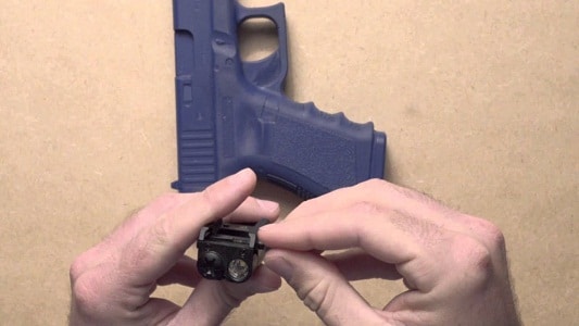 unscrewing of pistol light
