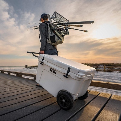 fisher with wheeled cooler