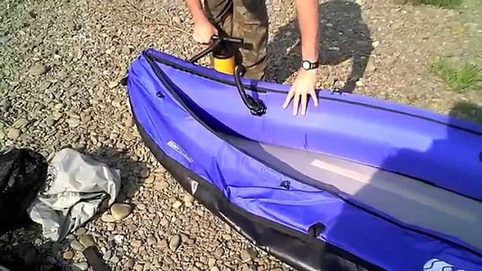 man pumping kayak