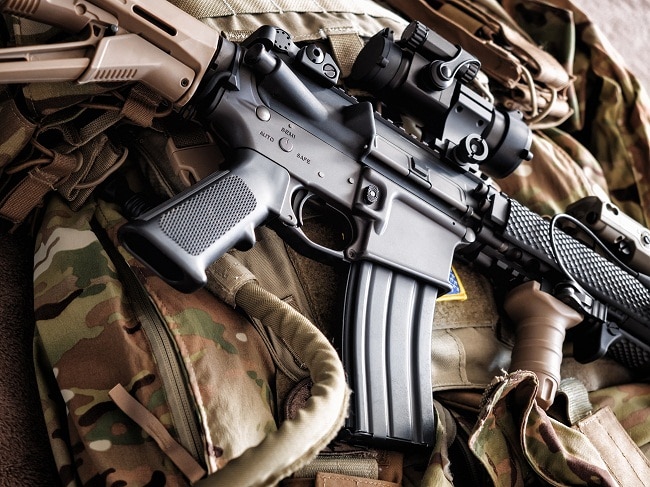 M4A1 (AR-15) tactical carbine on the bulletproof vest