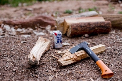 axe chopped firewood on the ground