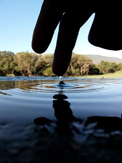 fingers dipped on water