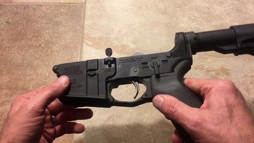 man holding Palmetto State Armory AR15 lower receiver