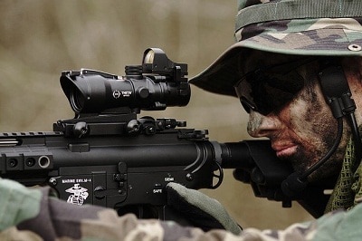 man in camouflage aiming airsoft gun