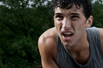 man sweating catching his breath